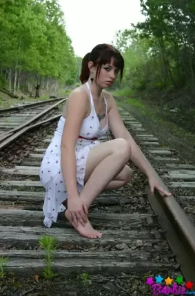 Images 2 - Девушка в белом сарафане фотографируется на железнодорожных путях 